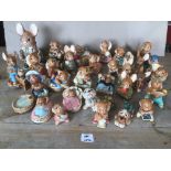A COLLECTION OF PENDELFIN RABBITS, INCLUDING FATHER RABBIT, MUNCHER AND MANY MORE