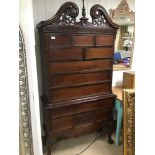 AN ORNATE MAHOGANY REPRODUCTION CHEST ON CHEST WITH BALL AND CLAW FEET