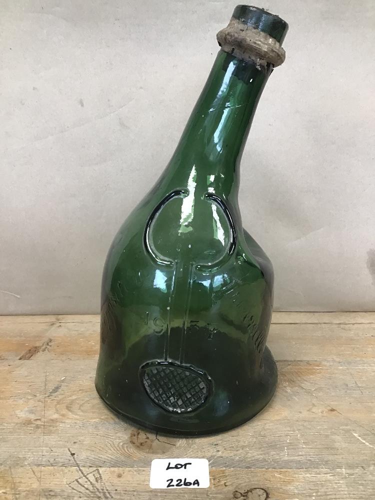 AN EARLY GREEN EXPOSITION UNIVERSELLE ARMAGNAC GLASS BOTTLE, DATED 1937, 29.5CM HIGH