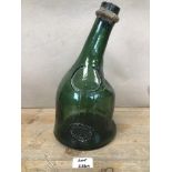 AN EARLY GREEN EXPOSITION UNIVERSELLE ARMAGNAC GLASS BOTTLE, DATED 1937, 29.5CM HIGH