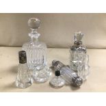 A COLLECTION OF CUT GLASS SCENT AND TOILETRIES BOTTLES, SOME WITH SILVER MOUNTS