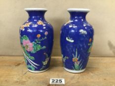 A PAIR OF JAPANESE PORCELAIN VASES, EACH DEPICTING A PEACOCK RESTING IN A TREE, 18.5CM HIGH