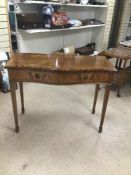 A VINTAGE SERPENTINE FRONTED TWO DRAWER CONSOLE TABLE
