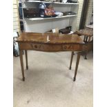 A VINTAGE SERPENTINE FRONTED TWO DRAWER CONSOLE TABLE