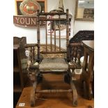 A VINTAGE CHILDS ROCKING CHAIR