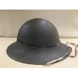 A MILITARY HELMET WITH ITS INNERS