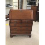 A MAHOGANY GEORGIAN BUREAU/DESK BY GEO TROLLOPE AND SONS OF LONDON