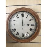 A VINTAGE PINE SURROUND WALL CLOCK