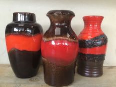 A GROUP OF THREE WEST GERMAN LAVA POTTERY VASES, LARGEST 21CM HIGH