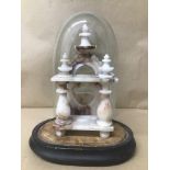 A LATE 19TH CENTURY CARVED ALABASTER POCKET WATCH STAND, PLACED IN ORIGINAL STAND WITH GLASS DOME,