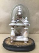 A LATE 19TH CENTURY CARVED ALABASTER POCKET WATCH STAND, PLACED IN ORIGINAL STAND WITH GLASS DOME,