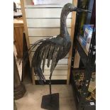 A LARGE METAL FIGURE OF A STYLIZED BIRD, 116CM HIGH