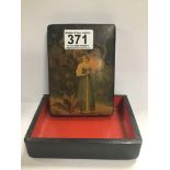 A RUSSIAN LAQUERED BOX OF RECTANGULAR FORM, THE LID WITH DECORATION DEPICTING A GIRL HOLDING A