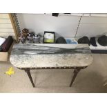 A METAL BASE AND MARBLE TOP CONSOLE TABLE