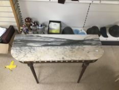 A METAL BASE AND MARBLE TOP CONSOLE TABLE