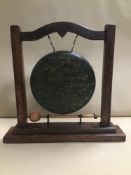 AN OAK DINNER GONG, 34CM HIGH