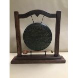 AN OAK DINNER GONG, 34CM HIGH