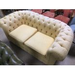 A VINTAGE REUPHOLSTERED CHESTERFIELD SOFA YELLOW WITH GOLD LEAF
