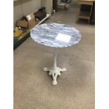 A METAL AND MARBLE TABLE