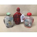 A GROUP OF THREE CHINESE SNUFF BOTTLES, TWO BEING GLASS WITH REVERSE PAINTED DECORATION, THE OTHER