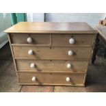 A VICTORIAN TWO OVER THREE PINE CHEST OF DRAWERS