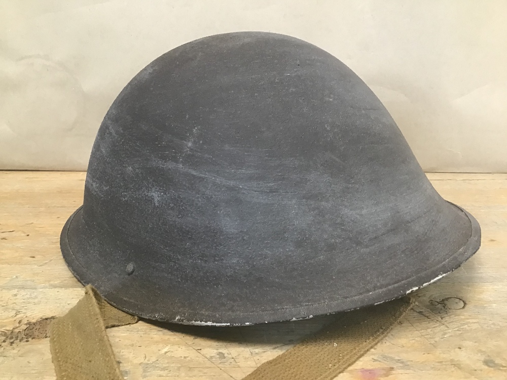 A MILITARY HELMET WITH ITS INNERS