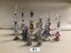 A COLLECTION OF GLASS SCENT BOTTLES, EACH WITH GILT DECORATION