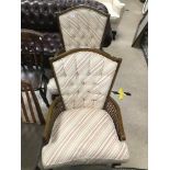 A VINTAGE PAIR OF CHAIRS WITH CANE WORKED SIDES