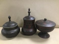 THREE MIDDLE EASTERN BRASS POTS WITH BLACK ENAMEL DECORATION