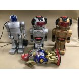 FOUR BATTERY OPERATED PLASTIC ROBOTS MADE IN HONG KONG (UNTESTED)