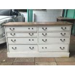 A PART PAINTED EIGHT DRAWER PINE UNIT WITH BRASS HANDLES 152 X 50 X H82 CMS