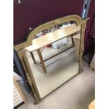 A LARGE GILDED FRAMED MIRROR WITH SIDE COLUMNS 126 X 128CMS