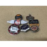 SIX VINTAGE ENAMEL MOTORCYCLE BADGES, INCLUDING BSA, MV AGUSTA, ROYAL ENFIELD AND HARLEY DAVIDSON,