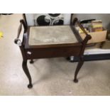 A VICTORIAN MAHOGANY PIANO STOOL WITH UPHOLSTERED SEAT