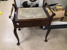 A VICTORIAN MAHOGANY PIANO STOOL WITH UPHOLSTERED SEAT