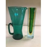 A TALL GREEN MURANO ART GLASS VASE, 22CM HIGH (CHIPPED) TOGETHER WITH AN ART GLASS POURING JUG