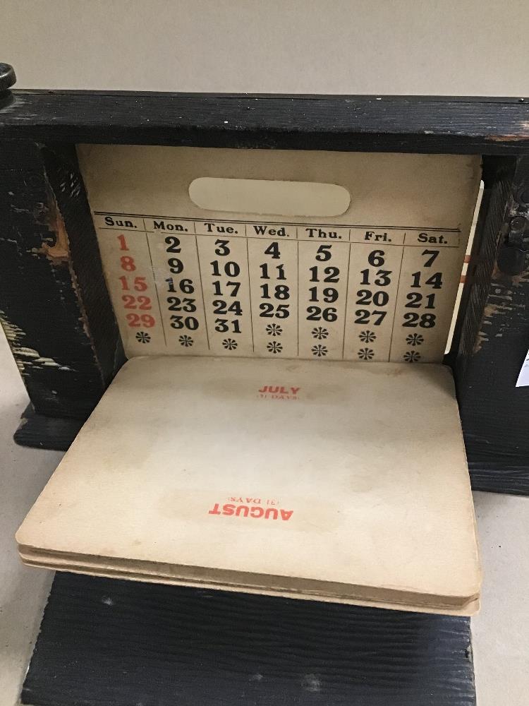 A VINTAGE BRASS AND WOOD DESK CALENDAR - Image 2 of 2