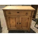 A VINTAGE PINE CUPBOARD WITH TWO DRAWERS