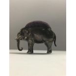 AN EDWARDIAN SILVER NOVELTY PIN CUSHION IN THE FORM OF AN ELEPHANT, HALLMARKS RUBBED BUT DATE LETTER