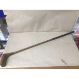 AN UNUSUAL EARLY WOODEN SHAFT PUTTER WITH HICKORY WOODEN END, MARKED GEO PEACOCK, LEATHER GRIP, 92CM