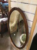 A VINTAGE BEVELLED EDGE MIRROR OVAL SHAPE WITH DECORATIVE INLAY 93 X 50CMS
