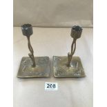 A PAIR OF GERMAN ART NOUVEAU CANDLESTICKS IN BRONZE