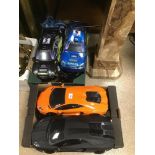 A COLLECTION OF REMOTE CONTROL TOY CARS.