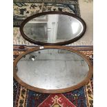 TWO OVAL WOODEN FRAMED MIRRORS LARGEST 83 X 58 CM