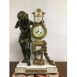AN A D MOUGIN FRENCH STRIKING CLOCK WITH A SPELTER CAST CHERUB PLAYING A HARP ON A WHITE MARBLE