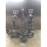 A GROUP OF SILVER PLATED CANDELABRAS AND CANDLESTICKS