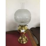 A VINTAGE DUPLEX BRASS OIL LAMP WITH AN ETCHED GLASS SHADE