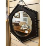 A VICTORIAN HEXAGON SHAPED OAK MIRROR BEVELLED EDGE WITH BOBBIN EDGES 60CMS DIAMETER