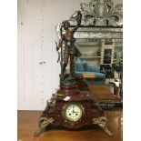 A SPELTER FIGURE OF A FISHERMAN RAISED UPON A RED MARBLE AND GILT FRENCH CLOCK THE STATUE MAKER IS