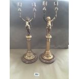 A PAIR OF GILDED COLUMN CANDELABRAS WITH MARBLE BASES
